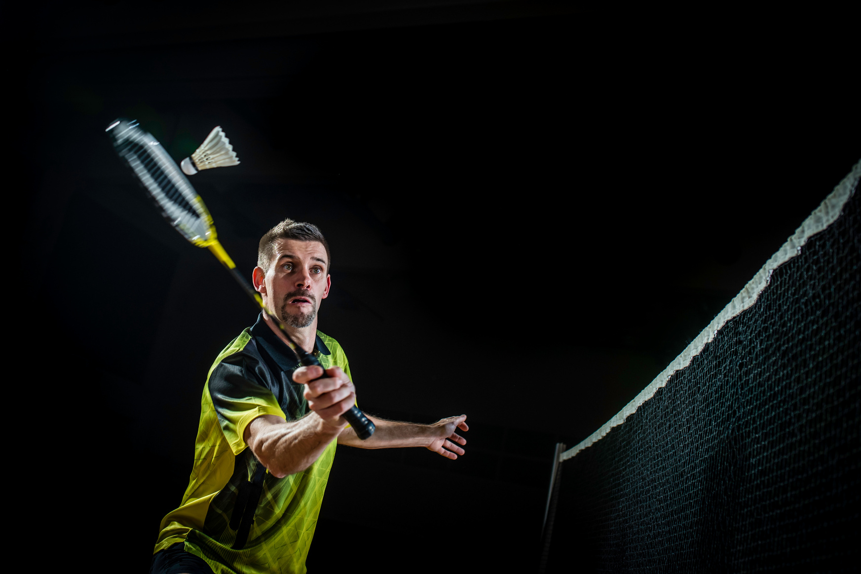 Man playing badminton